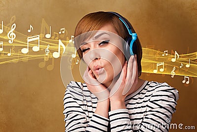 Young woman with headphones listening to music Stock Photo