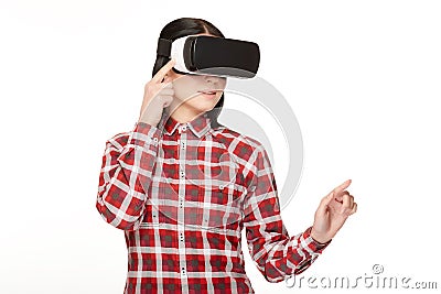 Young woman in headset of VR spending time in cyberspace. Stock Photo