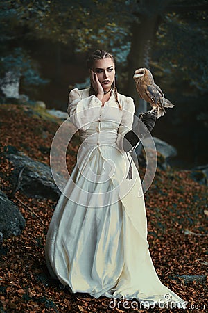 Young woman and her little barn owl Stock Photo