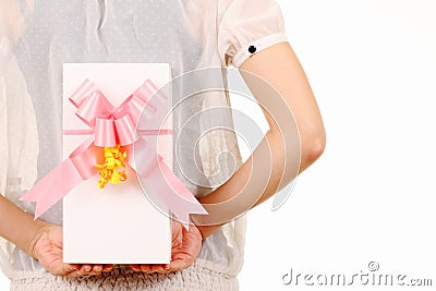 Young woman hide behind back the white gift box Stock Photo