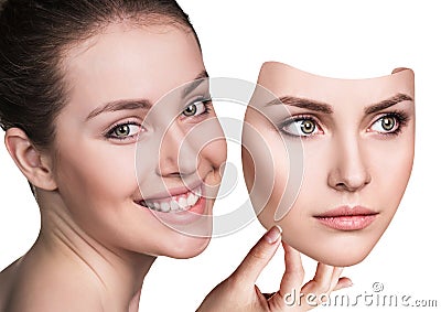 Woman hiding hapyiness under the serious mask Stock Photo