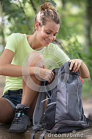 young woman hiking in forest Stock Photo