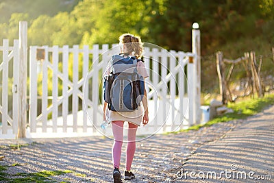 Young woman hiking in forests and mountains of Europe. Concepts of adventure, extreme survival, orienteering. Tourists camp Stock Photo