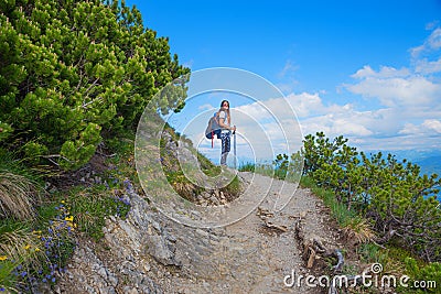 Young woman at hiking trail herzogstand mountain, bavarian alps Stock Photo