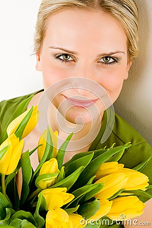 Young woman hold yellow tulips flower Stock Photo