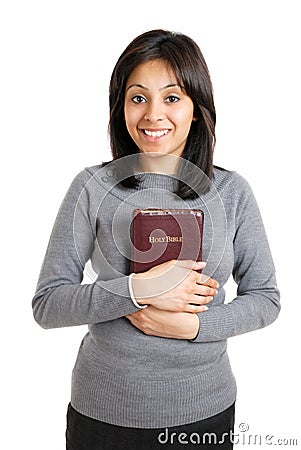 Young woman holding a bible showing commitment Stock Photo