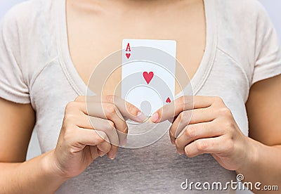 Young woman holding in hand poker card with combination of Full Stock Photo