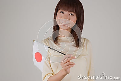 Young woman holding Japanese flag Stock Photo