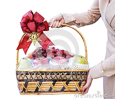Young woman holding new year fruit gift basket isolated on white background Stock Photo