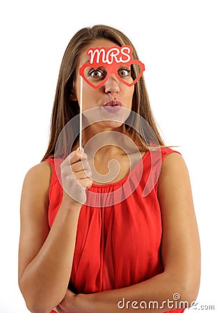 Young Woman Holding Photo Booth Prop Stock Photo