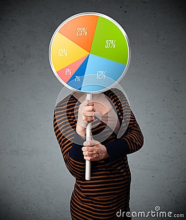 Young woman holding a pie chart Stock Photo