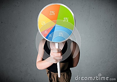 Young woman holding a pie chart Stock Photo