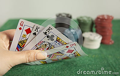 Young woman holding poker cards Stock Photo