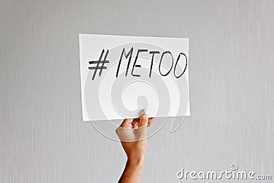 Young woman holding sign with metoo hashtag text. Sexual abuse, equal gender right. Stock Photo