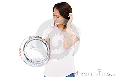 Young woman holding stainless steel clock Stock Photo