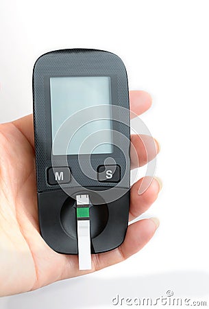 A young woman holds a glucometer in her hands and wants to do a blood test for sugar Stock Photo