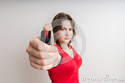 Young woman holds pepper spray in hand. Self defense concept Stock Photo