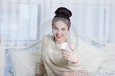 Young woman with a Hollywood smile taking selfie Stock Photo