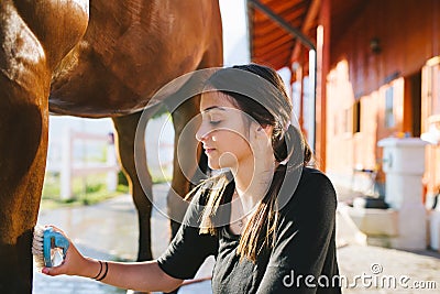 Young woman with horse Stock Photo