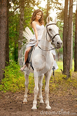 Young woman on a horse. Horseback rider, woman riding horse Stock Photo