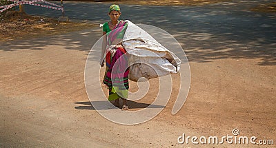 A young woman with a huge bag Editorial Stock Photo