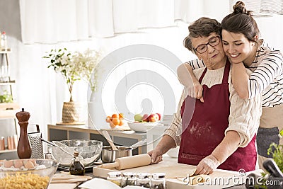 Young woman hugging her grandma Stock Photo