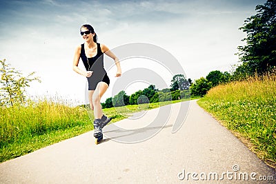 Young Woman With Inline Skates Stock Photo