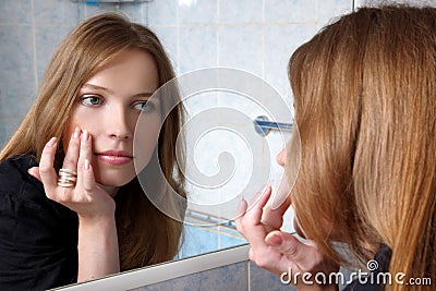 Young woman inspected skin Stock Photo