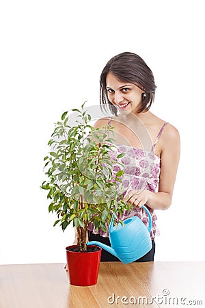 Young woman irrigate plants Stock Photo