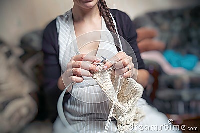 Young woman knits Stock Photo