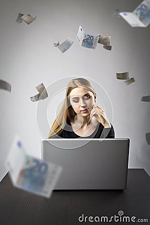 Young woman with laptop. Young woman and falling Euro banknotes Stock Photo