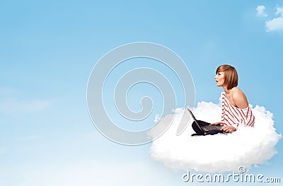 Young woman with laptop sitting on cloud with copy space Stock Photo