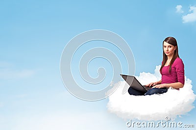 Young woman with laptop sitting on cloud with copy space Stock Photo