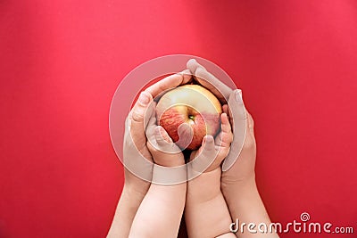 Young woman and little child holding apple Stock Photo