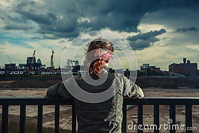 Young woman looking at city Stock Photo