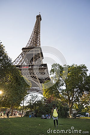 Young Woman looking at Eiffel Tower Editorial Stock Photo