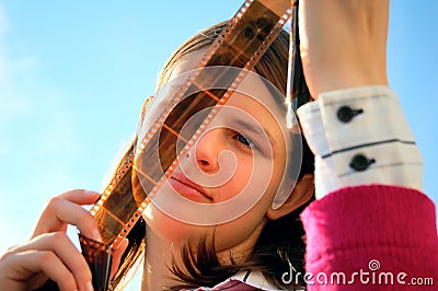 Young woman looking the film Stock Photo