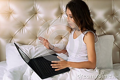 Young woman looking in laptop`s screen Stock Photo