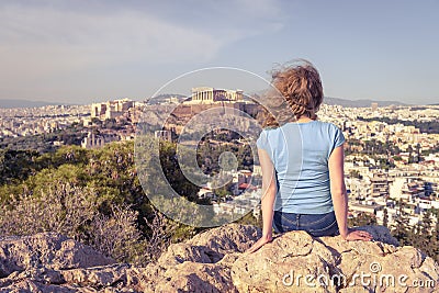 Young woman looks at cityscape of Athens from above, Greece Stock Photo