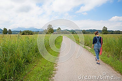 Young woman at loop road around chiemsee, bavaria Stock Photo