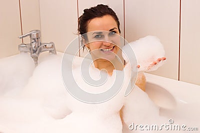 Young woman lying in the bath Stock Photo