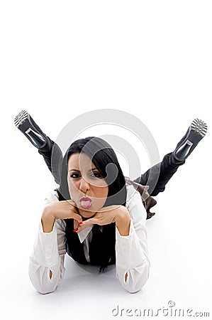 Young woman lying down on floor and teasing Stock Photo