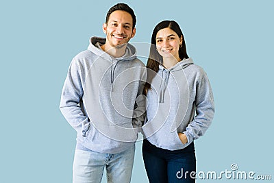 Young woman and man with trendy hoodies Stock Photo