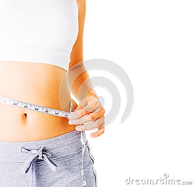 Young Woman Measuring Herself On White Stock Photo