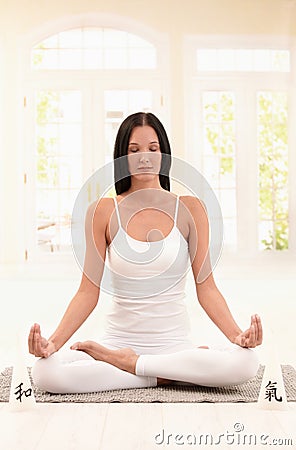 Young woman meditating Stock Photo