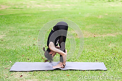 Young woman meditating in nature Stock Photo