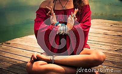 Young woman in a meditative yoga position outdoor Stock Photo