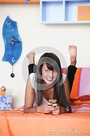 Young woman in modern bedroom Stock Photo