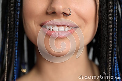 Young woman with nose piercing and dreadlocks Stock Photo