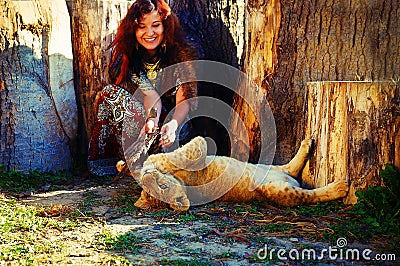 Young woman with ornamental dress and gold jewel Stock Photo